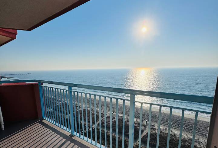 Ocean view from balcony at sunrise.