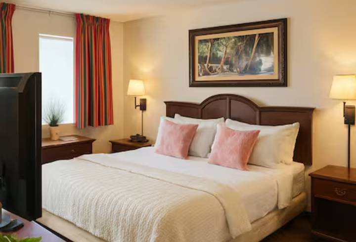 Cozy hotel room with double bed.