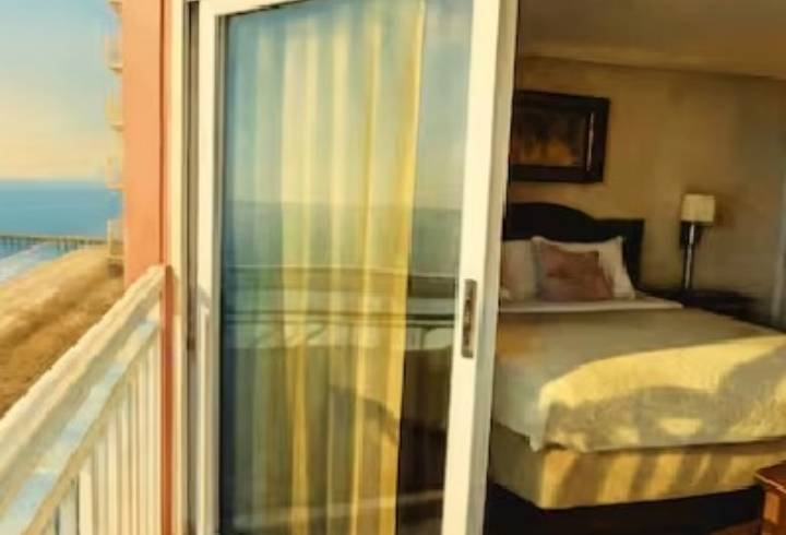Bedroom with ocean view and balcony.
