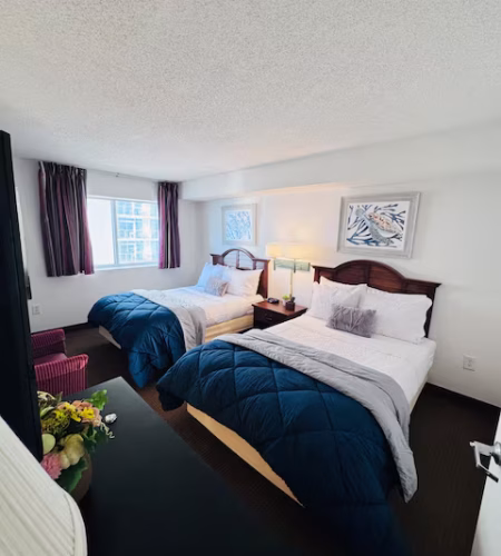 Hotel room with two double beds.