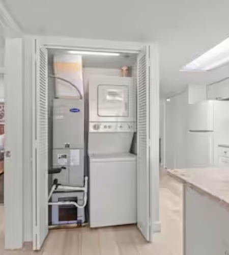 Laundry area in modern kitchen space.